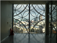 Looking from inside the library through the tracery to the views of the city.